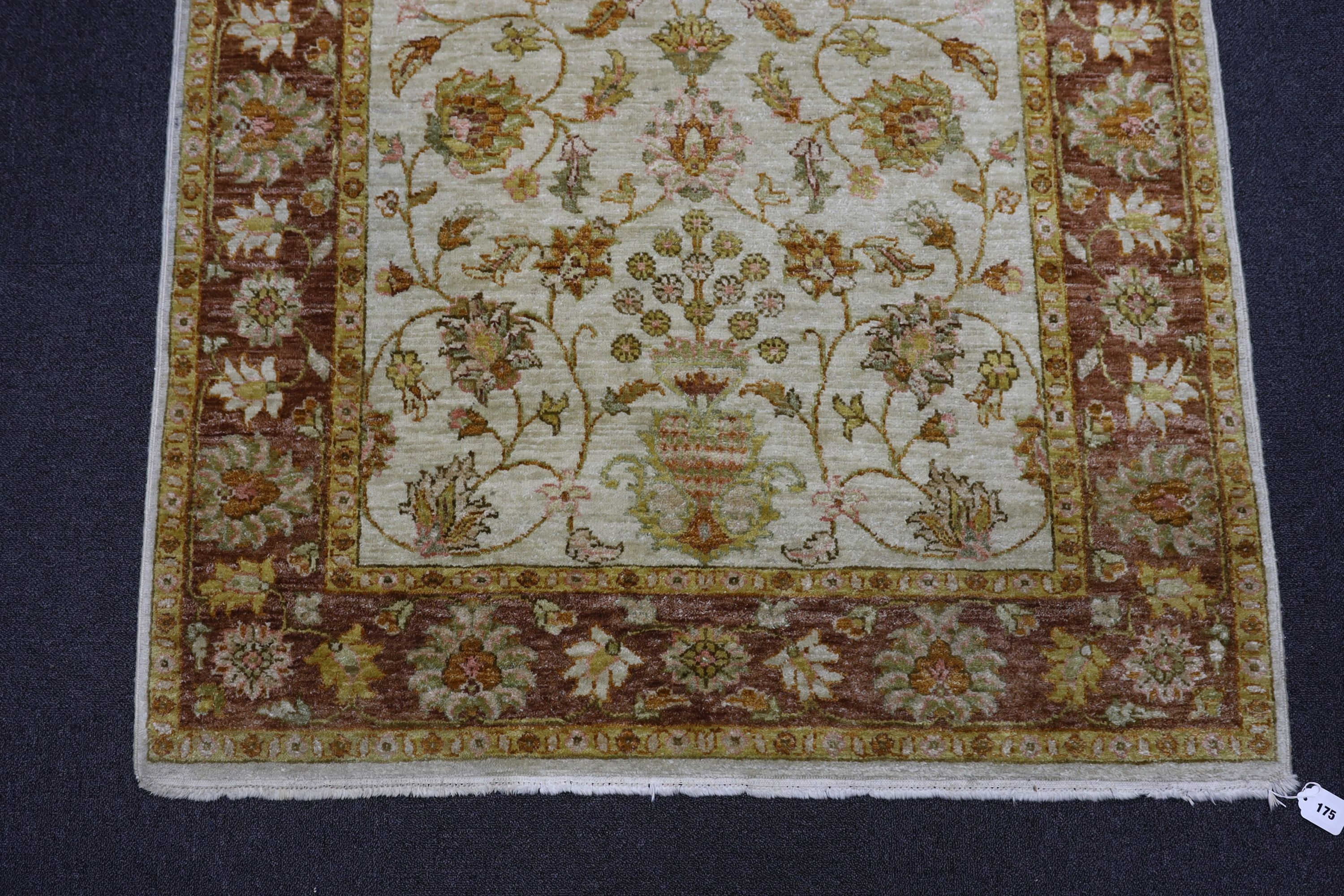 A Ziegler style ivory ground rug, 188 x 122cm